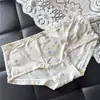 [80-120] 524 Seda de Hielo estampado lindo tiro bajo bolsa de ropa interior para mujer cadera con taladro ropa interior para mujer tiro bajo