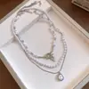Collar redondo de perlas con cuentas vintage, moda nicho de alta gama, cadena para la clavícula simple y elegante, accesorio de lujo ligero exquisito y versátil
