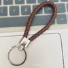 Llavero de cuerda de cuero trenzado simple creativo colgante de muñeca linda accesorios de llave para parejas tendencia regalos pequeños venta al por mayor