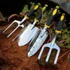 Juego de herramientas de jardinería para jardín al por mayor pala de jardín pala aleación de magnesio y aluminio mango de silicona de dos colores juego de cuatro piezas