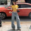 Foto real de jeans reto estiloso com padrão de estrela e strass para mulheres, novidade da primavera de 2026, calça pantalona de cintura alta que afina