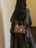 Bolso de mano pequeño versátil para mujer para pedidos extranjeros, nuevo bolso de hombro de moda popular 2026, bolso cruzado cuadrado pequeño elegante