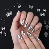 Decorações de Nail Art Cruzadas de 12 Grades Transfronteiriças em Formato de Cruz Misturadas com Contas de Aço Grandes e Pequenas, Borboleta Oca Laço de Gravata Liga Metálica Acessórios Vestíveis para Unhas