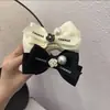 Horquilla de estilo francés con lazo de cuentas de camelia, elegante horquilla estilo Chanel con bola, tocado de cola de caballo alta para mujer