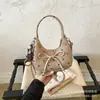 Bolso tipo empanada de lunares de nicho súper popular para mujer, nuevo bolso de mano y bandolera versión coreana Otoño 2026, moderno para ir al trabajo