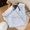 Calça Reta com Estampa de Laços Listrados Azuis 2026 Novo Verão Casual Versátil Calça Wide Leg para Mulheres Calça Longa de Cintura Alta