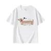 Camiseta Branca de Verão Novo Estilo com Gola Redonda e Manga Curta para Mulheres com Estampa de Cachorrinho Cartoon, Top Soltinho Casual e Versátil para Mulheres