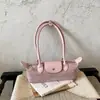 Bolso tipo baguette de lujo de nicho estilo francés, bolso tipo dumpling moderno y a la moda, adecuado para el uso diario, bolso versátil y moderno para hombro y debajo del brazo