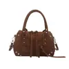 Bolso de mano con textura de tendencia transfronteriza, bolso tipo almohada para mujer, nuevo de Otoño 2026, color liso, con remaches, bolso de hombro único, bolso cruzado para el día a día