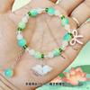 Barraca de ponto cênico vendendo joias feitas à mão com miçangas imitação de jade contas de barril pulseira de vidro atacado masculino e feminino este ano pulseira