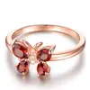 Anillo europeo y americano de oro rosa rubí mariposa abierto dulce accesorios para citas joyería de fábrica al por mayor