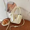 Bolsas Pequeñas de Verano de Moda Transfronterizas para Mujer 2026 Nueva Moda Bolso Cruzado Versátil Bolso de Mano Súper Popular Bolso Cubo
