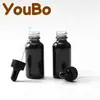 Botella gotero de vidrio Boston transparente negro para cosméticos líquidos, aceite esencial, 30 ml, caja de envío transfronterizo