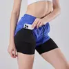 Pantalones cortos transpirables para entrenamiento de comercio exterior transfronterizo para hombres y mujeres, con forro anti-exposición, diseño de dos piezas falsas, adecuados para correr y deportes al aire libre