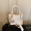 Bolsa Pequena Estilo Cesta Casual Primavera e Verão para Mulheres Novo Modelo 2026 Bolsa Transversal de Alto Padrão para o Dia a Dia Bolsa de Cesta Xadrez Estilosa