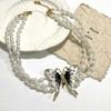 Collar de perlas multicapa con colgante de mariposa de diamantes franceses, elegante y delicado, cadena de clavícula femenina de Chanel.