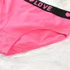 Ropa interior de algodón Ropa interior con logo estampado Ropa interior de color liso de cintura media Braguitas de talla europea para mujer Ropa interior de carta de amor
