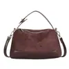 Nuevo bolso de hombro retro de gamuza 2026 para mujer, un bolso tipo almohada para la axila elegante y versátil, perfecto para ir al trabajo y se puede llevar como bolso de mano o cruzado