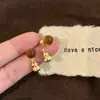 Pendientes de Calabaza Maillard Ojo de Tigre para Mujer Otoño e Invierno Retro Pendientes de Alta Gama Nuevo Estilo Chino Pendientes de Diseño de Nicho