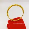 Pulsera de cuentas de transferencia electroplateadas de suministro en vivo tiembla con pulsera de cuentas de transferencia push-pull chapada en cobre y oro para damas al por mayor