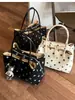 Bolso de mano de lona con lunares de gran capacidad para mujer, nuevo modelo 2026, de alta gama, lujo ligero, bolsa tote de nicho para el trabajo