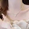 Collar Colgante de Perlas y Circonitas con Forma de Lazo para Mujer Cadena de Clavícula Ligera de Lujo de Alta Gama Temperamento Accesorio Versátil