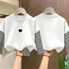Camiseta de manga larga a rayas de algodón puro para niñas, estilo primavera y otoño, imitación de dos piezas, top de dibujos animados estiloso para niños mayores