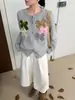 Elegante chaqueta suéter con lazo tridimensional, nuevo modelo otoño e invierno 2026, cárdigan de punto holgado de alta gama con cuello redondo para mujer