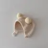 Estilo coreano ins outono e inverno Novo bebê earmuffs quente à prova de frio chapéu confortável bebê Double Ball soft glutinous toe cap moda