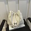 Bolso de Hombro Grande de Alta Apariencia Estilo Coreano con Cordón Gran Capacidad Moda Nueva Primavera 2026 Moño Simple Versátil Elegante