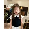 Conjunto Estilo Preppy para Niña 2026 Verano Nuevo Estilo de Alta Gama Niña Pequeña Falso Dos Piezas Camiseta Top Falda Corta Blanca