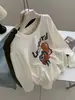 Camiseta Larga de Algodón Cepillado con Estampado de Dibujos Animados Lindos Estilo Coreano para Mujer 2026 Otoño Nueva Holgada Versátil Estilo Ins Superior