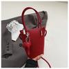 Bolso de Mano Pequeño de Gama Alta con Diseño de Nicho para Mujer 2026 Nuevo Versátil Bolso Cubo Cruzado Simple para el Trabajo Bolso de Hombro