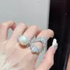 Anillos de perlas naturales de lujo coreanos y europeos para mujer, joyería de circonita al por mayor, anillos abiertos de nicho lujosos estilo Chanel