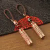 Llavero de tarro con mantra Lingyagn de aceite rojo, tarro hueco de latón puro con sutra, se puede abrir para guardar sutras, colgante de cuerda trenzada hecho a mano