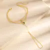 Cadena de dedo y muñeca integrada con borla multicapa dorada chapada en cobre, estrella de ocho puntas con gemas de colores, cadena para el dorso de la mano tipo nariz de cerdo, joyería de mano de estilo mixto