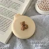 Bonito peine pequeño, mini peine de cojín de aire portátil para niños y niñas, peine plegable con airbag, peine de masaje con espejo integrado