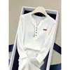 Camiseta de algodón de manga larga con cuello en V abotonado, diseño de copo de nieve para mujer, top blanco moderno y versátil, ropa de mujer Otoño 2026