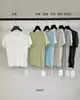 TG Pure Clean de Alta Gama Tejido de Punto Trenzado Versátil Adelgazante Semiabierto de Manga Corta Camiseta de Punto Nuevo Llegado Verano 2026 26657