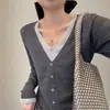 ¡Estilo nicho coreano! Otoño 2026 diseño retro patchwork de bloques de color punto de manga larga de dos piezas simuladas cuello en V
