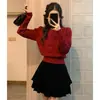 Top elegante de cuello redondo estilo coreano para primavera y otoño con mangas abullonadas y entallado en la cintura, suéter de punto liso hueco de invierno para mujer