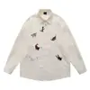 Camisas de Lapela Bordadas com Desenhos Estilo Coreano de Manga Longa para Homens e Mulheres, Novas Moda Casual Solta com Efeito Emagrecedor para Primavera e Outono