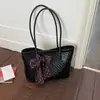 Bolsa de mano de lujo de alta gama para mujer, nuevo modelo de verano 2026, bolso de hombro con patrón tejido de nicho, bolso de mano de gran capacidad