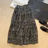 Saia casual boêmia com estampa vintage de outono para mulheres, saia longa com cintura elástica, roupa feminina versátil, saia com barra ampla e fluida