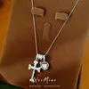 Collar con cruz en forma de corazón adornada con circonitas, cadena para clavícula de lujo ligero de nicho, único y elegante con un toque de alta gama, venta al por mayor