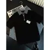 Camiseta de polo de manga corta para hombre de estilo americano, con media cremallera, retazos a cuadros, para adolescentes, con un look fresco y sofisticado.