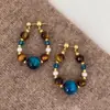 Pendientes de Cuentas de Ojo de Tigre Azul Aguja Plateada de Color Contrastante para Mujer Lujo Accesible Nicho Retro Otoño e Invierno Pendientes de Ojo de Tigre Maillard