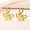 Brincos de aço inoxidável novos transfronteiriços brincos com pingente de laço feminino brincos brincos banhados a ouro uma geração de cabelo