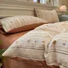 Nuevo juego de cuatro piezas jacquard teñido en hilo de alto peso, estilo simple y fresco, ropa de cama estilo princesa de lujo ligero