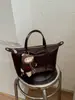 Bolsa transversal de design nicho coreano para mulheres, nova moda 2026 bolsa de ombro de grande capacidade, bolsa de antebraço vintage de alta qualidade
